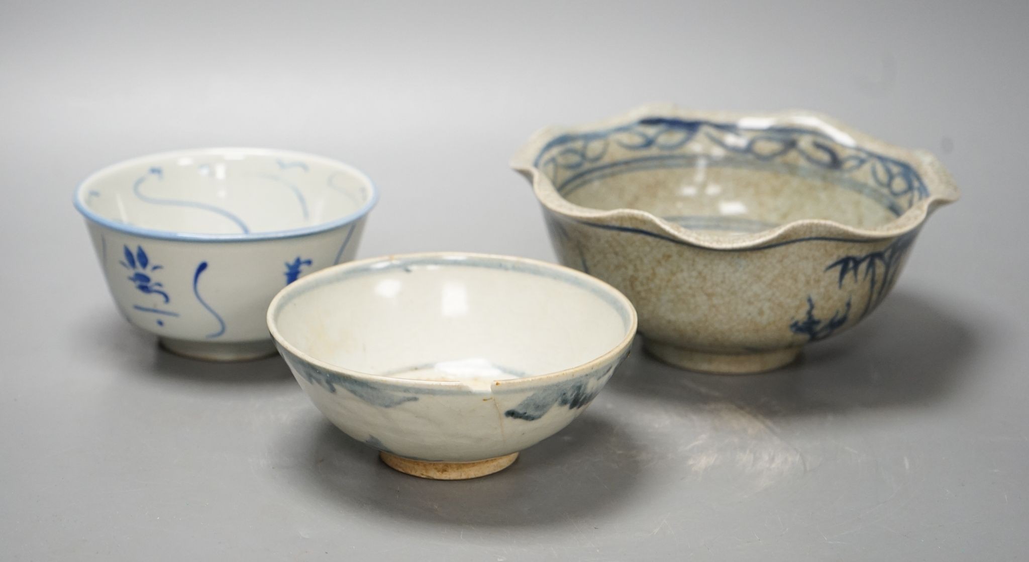 Three Chinese porcelain blue and white bowls, largest 17cm. diam.